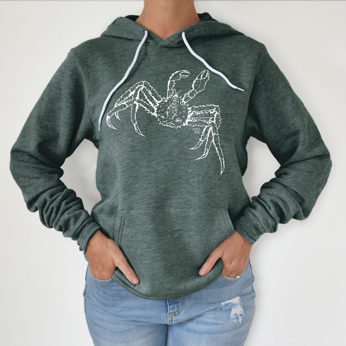 hand drawn alaskan king crab design on a green pullover hoodie