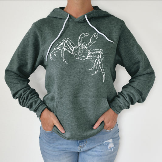 hand drawn alaskan king crab design on a green pullover hoodie