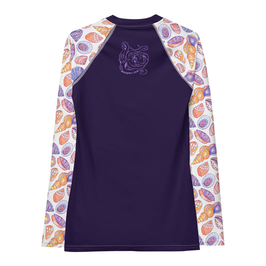hand painted watercolor shell design in purples and corals on a ladies sun shirt