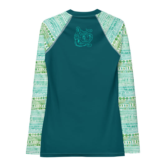 hand painted watercolor design in greens and teals on a ladies rash guard