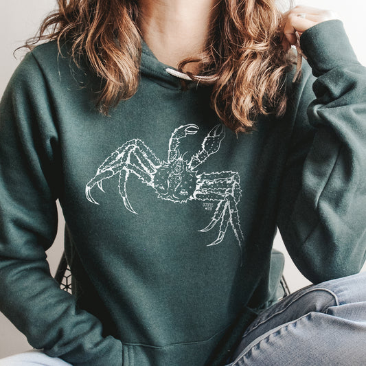 hand drawn alaskan king crab design on a green pullover hoodie