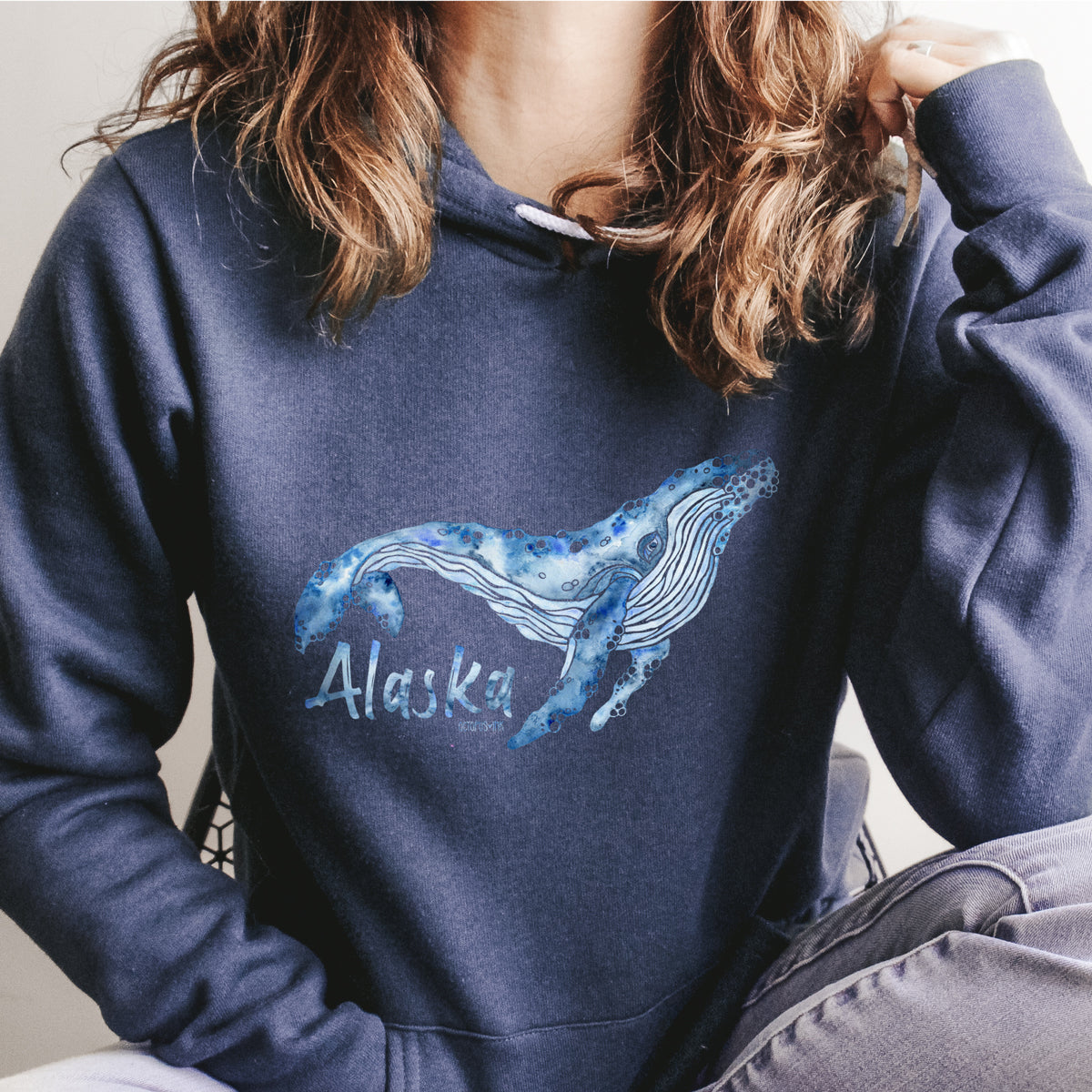 had painted watercolor whale design on a navy fleece