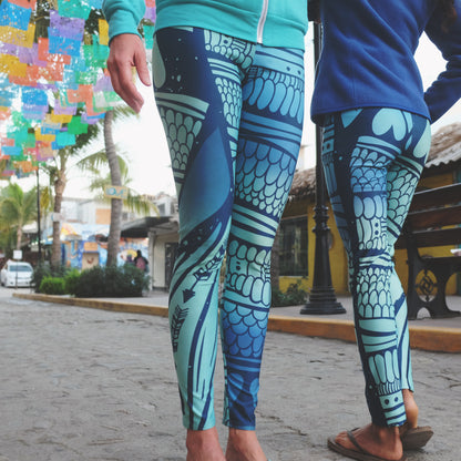 mermaid inspired ladies leggings with scales, arrows, and hearts in blues and greens