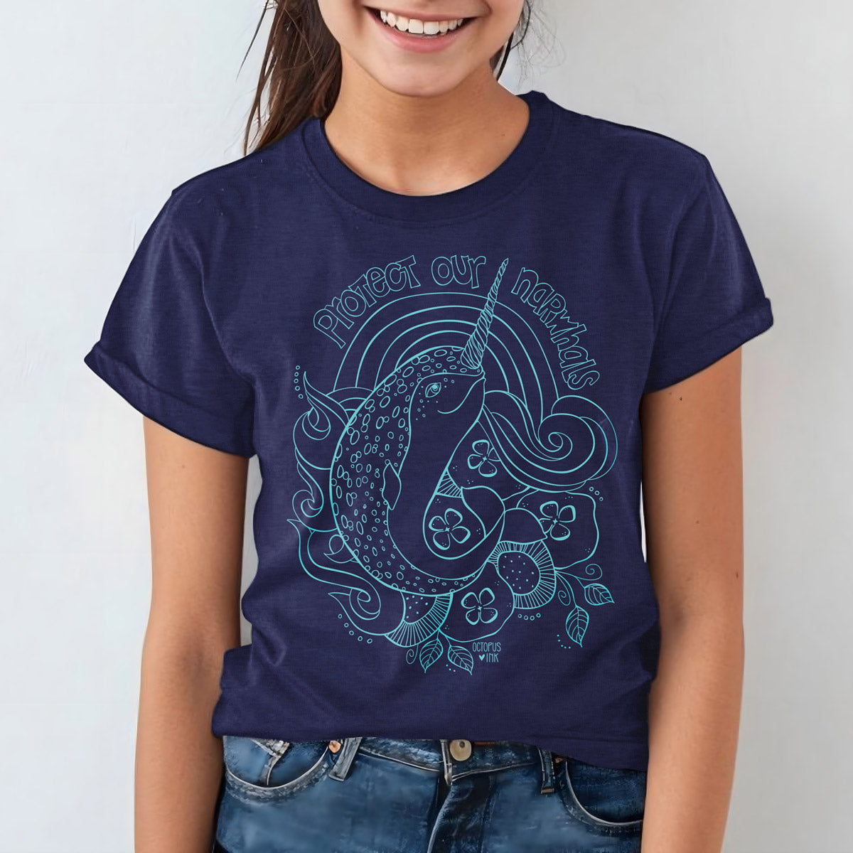 hand drawn narwhal design on navy unisex youth tee