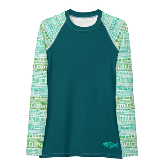 hand painted watercolor design in greens and teals on a ladies rash guard